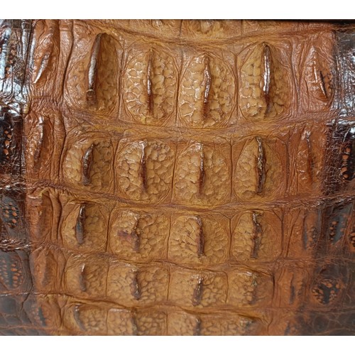655 - A crocodile skin brief case and similar handbag (2)