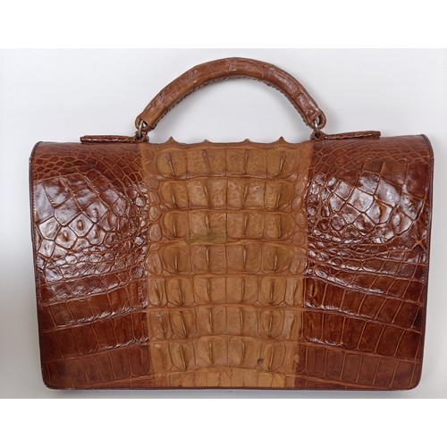 655 - A crocodile skin brief case and similar handbag (2)