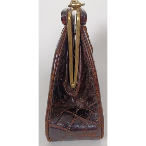 655 - A crocodile skin brief case and similar handbag (2)