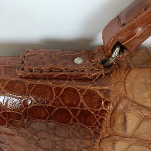 655 - A crocodile skin brief case and similar handbag (2)