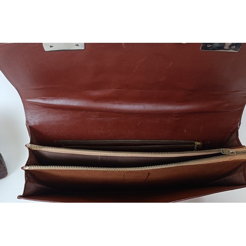 655 - A crocodile skin brief case and similar handbag (2)