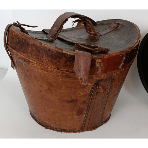 657 - A moleskin top hat, by Christys of London, in a leather carry case and three bowler hats (4)