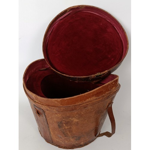 657 - A moleskin top hat, by Christys of London, in a leather carry case and three bowler hats (4)