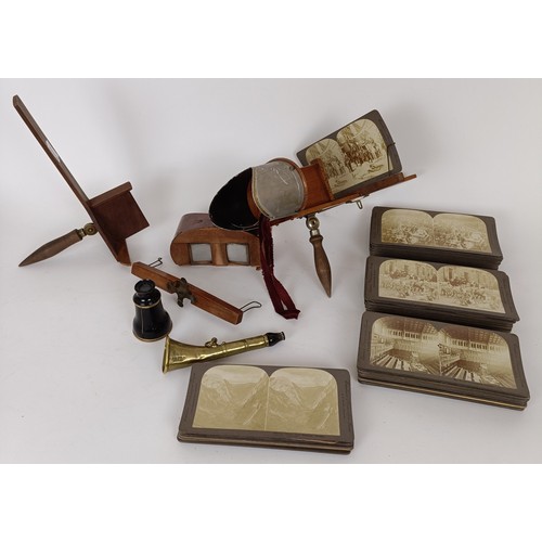 719 - A stereoscopic viewer, another, various cards and a monocular