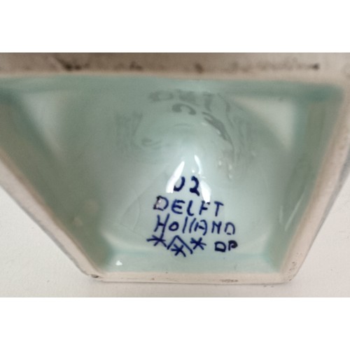 745 - A Delft vase, 33 cm high, another lacking cover, 30 cm high and a Delft vase, 17 cm high (3)