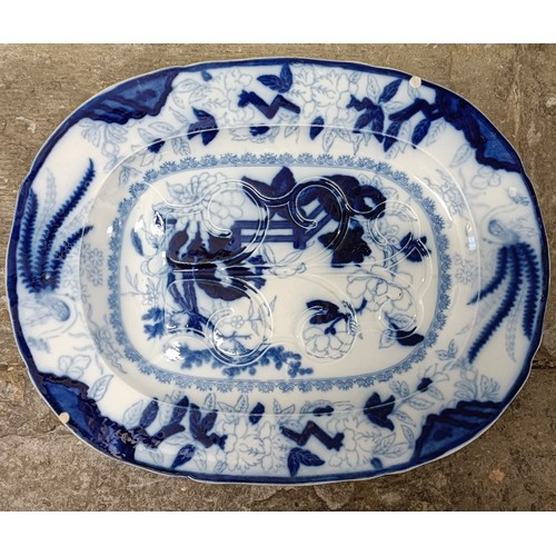 756 - A large Staffordshire blue and white meat plate, 63 x 50 cm and a blue and white meat plate, with a ... 