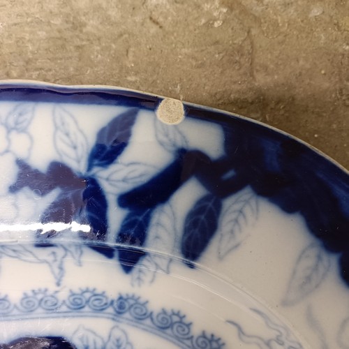 756 - A large Staffordshire blue and white meat plate, 63 x 50 cm and a blue and white meat plate, with a ... 
