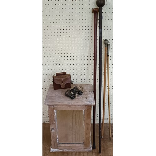 759 - A swagger stick, with a silver plated finial, another, two walking sticks, a pair of binoculars and ... 