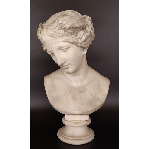 637 - A 19th century carved marble bust of a lady, on a round base, 56 cm high