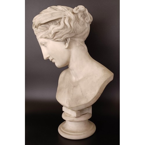 637 - A 19th century carved marble bust of a lady, on a round base, 56 cm high