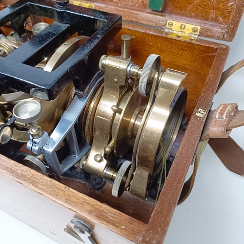 775 - A theodolite, cased, with a tripod (2)