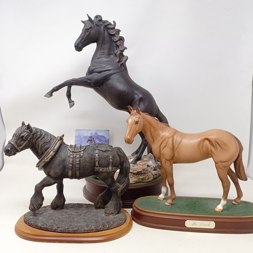 607A - A Beswick figure, Cancara The Black Horse, 40 cm high, a Doulton horse and a figure of a horse (3)