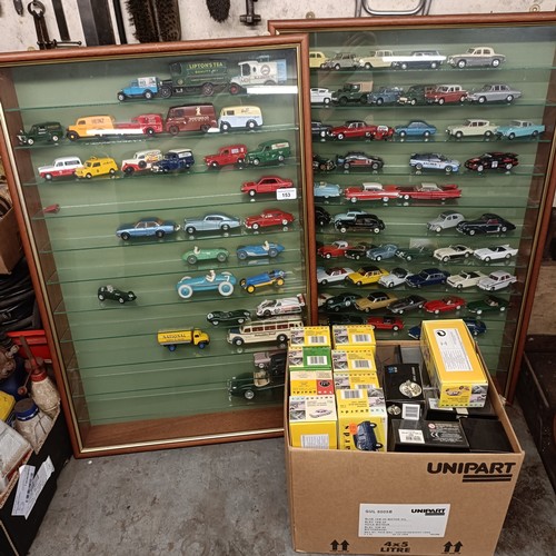 153 - Two wall mounted cases of die cast model vehicles, each cabinet 56.5 cm wide, and a group of boxes f... 