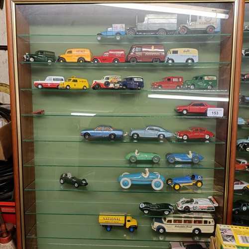 153 - Two wall mounted cases of die cast model vehicles, each cabinet 56.5 cm wide, and a group of boxes f... 