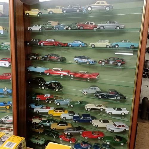 153 - Two wall mounted cases of die cast model vehicles, each cabinet 56.5 cm wide, and a group of boxes f... 