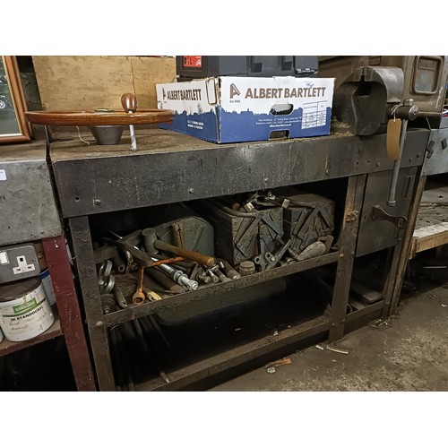 156 - A metal workbench, 125 cm wide, mounted with a vice, approx 128 cm wide