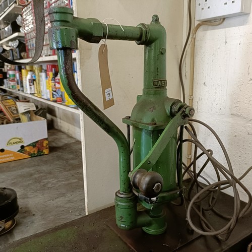 158 - A green painted forecourt oil dispenser, with contents of oil