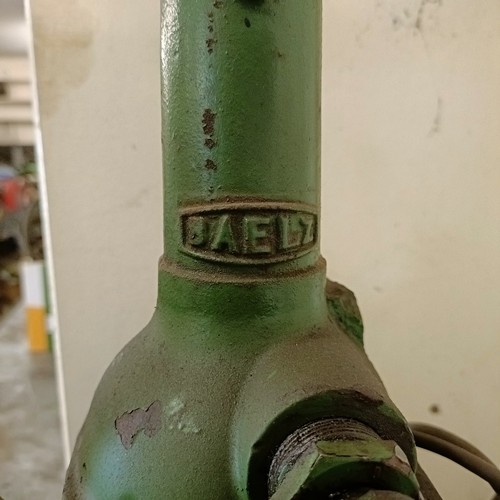 158 - A green painted forecourt oil dispenser, with contents of oil