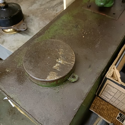 158 - A green painted forecourt oil dispenser, with contents of oil