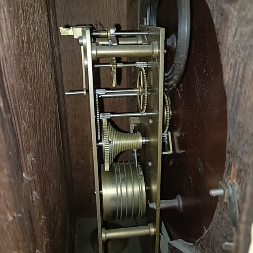 333 - A clock, the painted dial fitted a single fusee movement, in an oak case, 40 cm wide