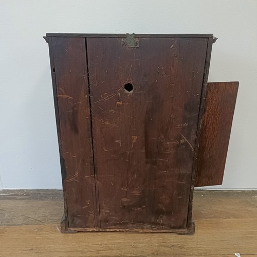 333 - A clock, the painted dial fitted a single fusee movement, in an oak case, 40 cm wide