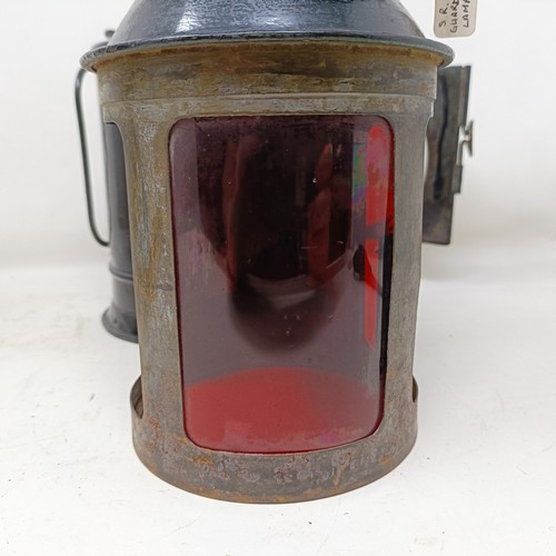 2053 - A GWR guard's lamp, by G Polkey Ltd, Birmingham, 34 cm high, and an SR(E) guard's lamp, 35 cm high (...