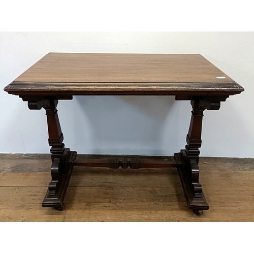 507359 - A 19th century mahogany library table, with two frieze drawers, on a column support to splay legs, 1... 