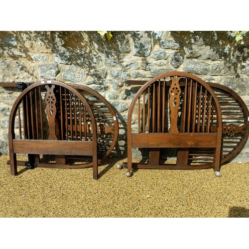 622 - A pair of oak wheel back single bed ends, 93 cm wide (4)