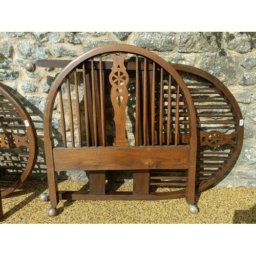 622 - A pair of oak wheel back single bed ends, 93 cm wide (4)