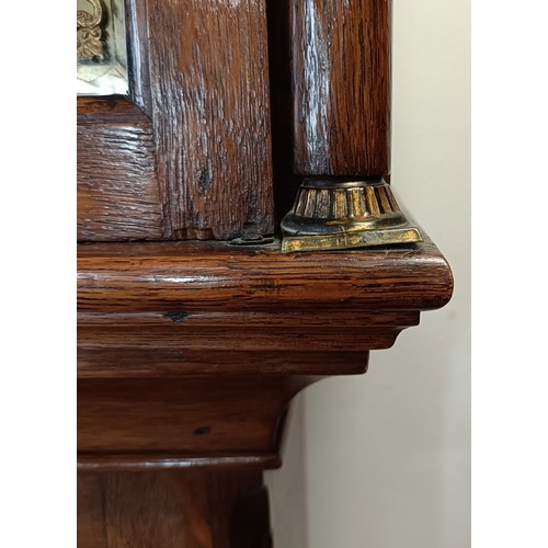 328 - A longcase clock, the brass dial with a subsidiary seconds dial and date aperture, fitted an eight d... 