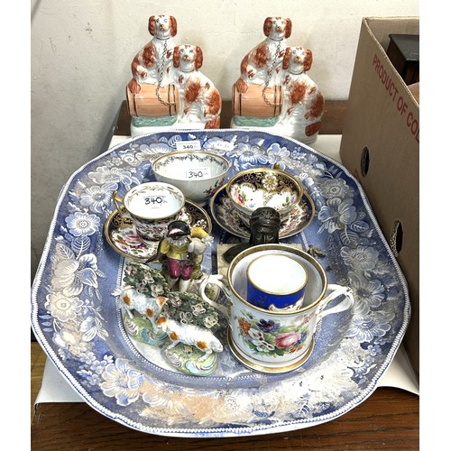340 - A cabinet cup and saucer, decorated flowers, a blue and white meat plate with a gravy well and assor... 