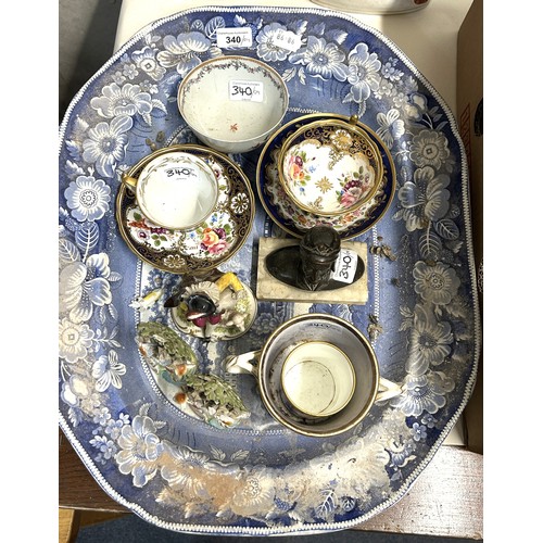 340 - A cabinet cup and saucer, decorated flowers, a blue and white meat plate with a gravy well and assor... 