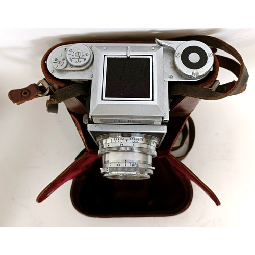 309 - An Agiflex camera and assorted other photographic equipment, in a suitcase