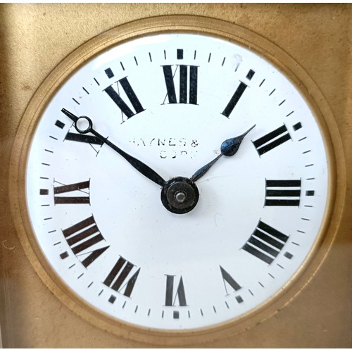 311 - A carriage clock, with an eight day movement, striking on a chime, 17 cm high, in a leather travel c... 