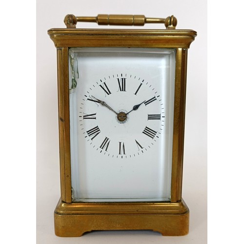 312 - A carriage clock, the 6 cm wide enamel dial with Roman numerals, striking on a gong, in a brass case... 