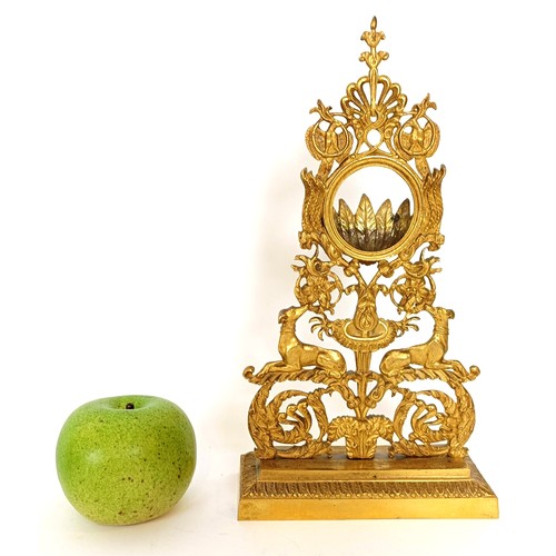 313 - A gilt metal watch stand, with floral and dog supports, 27.5 cm high
