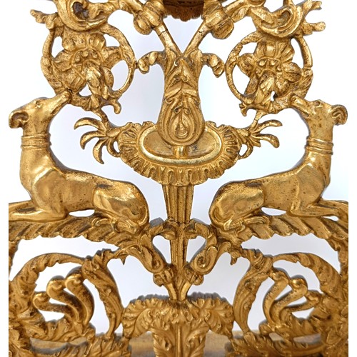 313 - A gilt metal watch stand, with floral and dog supports, 27.5 cm high
