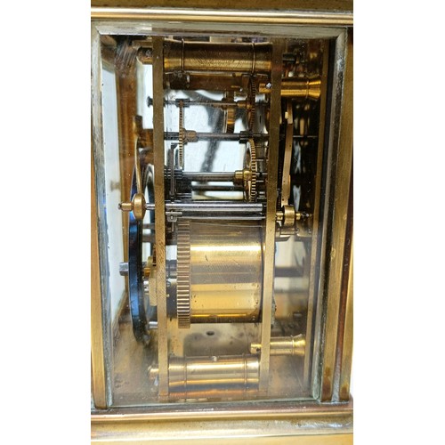 317 - A carriage clock, with a repeat, 18 cm high