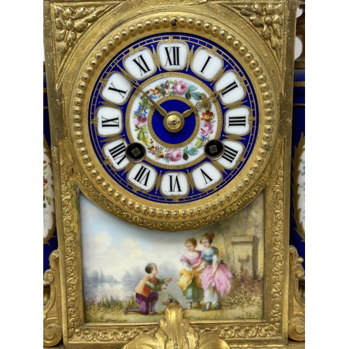 332 - A mantel clock, the porcelain dial decorated flowers, fitted an eight day movement, striking on a be... 