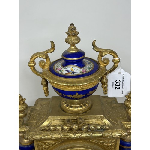 332 - A mantel clock, the porcelain dial decorated flowers, fitted an eight day movement, striking on a be... 