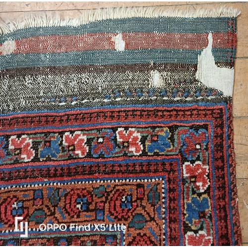 624 - A Persian type carpet, central rectangular medallion, with repeating floral motifs, 216 x 127 cm