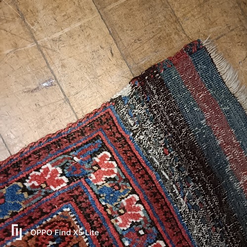624 - A Persian type carpet, central rectangular medallion, with repeating floral motifs, 216 x 127 cm