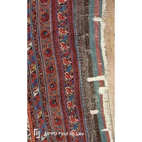 624 - A Persian type carpet, central rectangular medallion, with repeating floral motifs, 216 x 127 cm