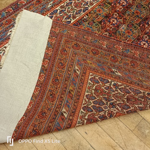 624 - A Persian type carpet, central rectangular medallion, with repeating floral motifs, 216 x 127 cm