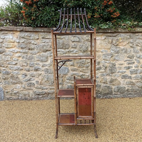961 - An unusual Aesthetic period bamboo open cabinet, with a stylised pagoda top and lacquered panels, 18... 