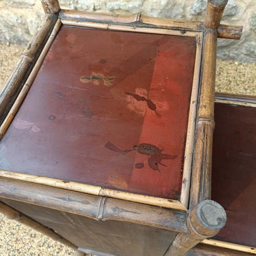 961 - An unusual Aesthetic period bamboo open cabinet, with a stylised pagoda top and lacquered panels, 18... 