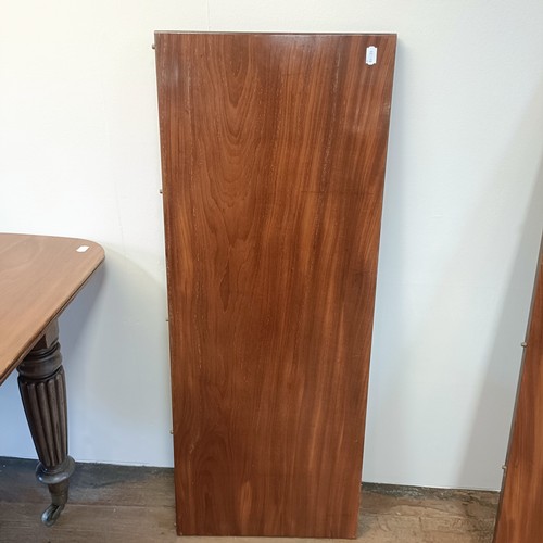 997 - A 19th century mahogany extending dining table, on turned reeded tapering legs to casters, the top, ... 