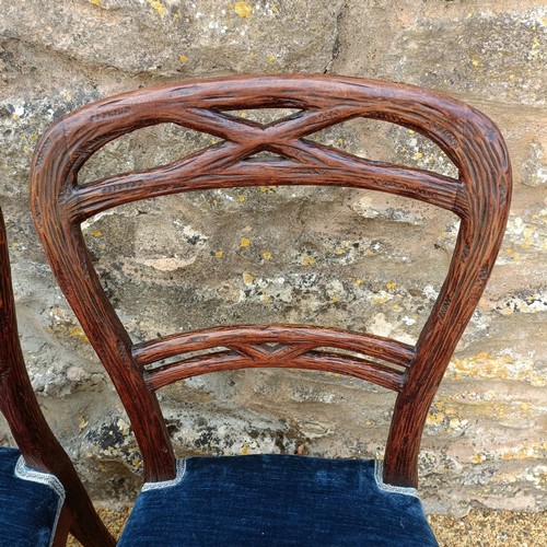 985 - An unusual set of ten Black Forest style carved dining chairs, with padded seats (10)