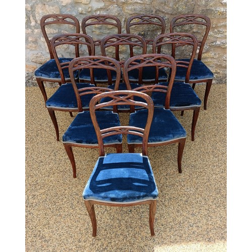 985 - An unusual set of ten Black Forest style carved dining chairs, with padded seats (10)
