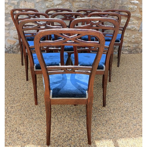 985 - An unusual set of ten Black Forest style carved dining chairs, with padded seats (10)